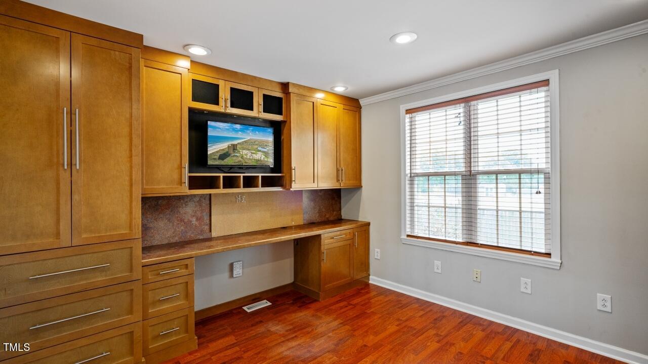 1065 Smith Road Smithfield, NC 27577 - Photo 19 of 36 a living room with stainless steel appliances kitchen island granite countertop a sink and a window