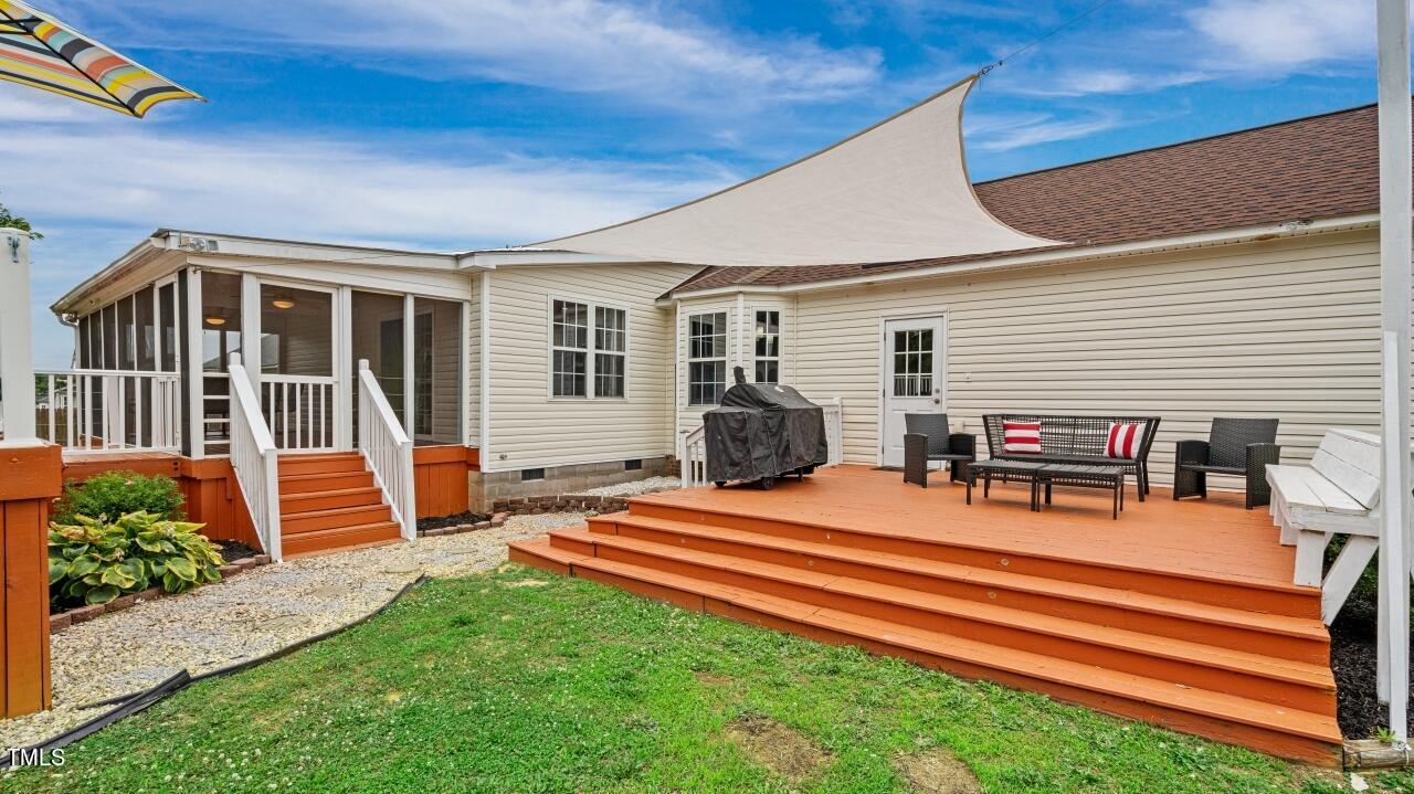 1065 Smith Road Smithfield, NC 27577 - Photo 2 of 36 a backyard of a house with seating space