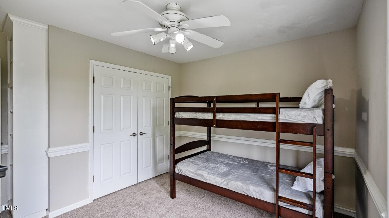 1065 Smith Road Smithfield, NC 27577 - Photo 21 of 36 a view of room with stairs and a chandelier