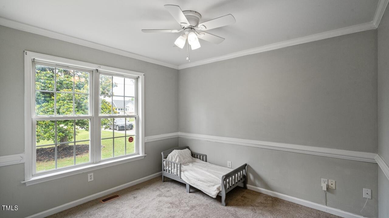1065 Smith Road Smithfield, NC 27577 - Photo 24 of 36 a living room with furniture and a window