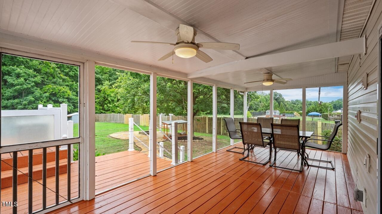 1065 Smith Road Smithfield, NC 27577 - Photo 29 of 36 a view of a dining room with furniture window and wooden floor