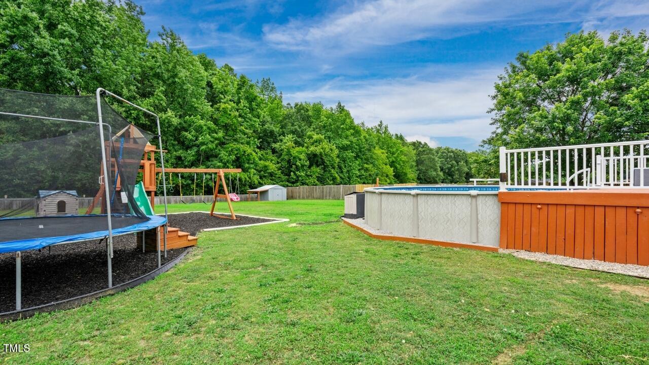 1065 Smith Road Smithfield, NC 27577 - Photo 32 of 36 a view of a deck with a yard