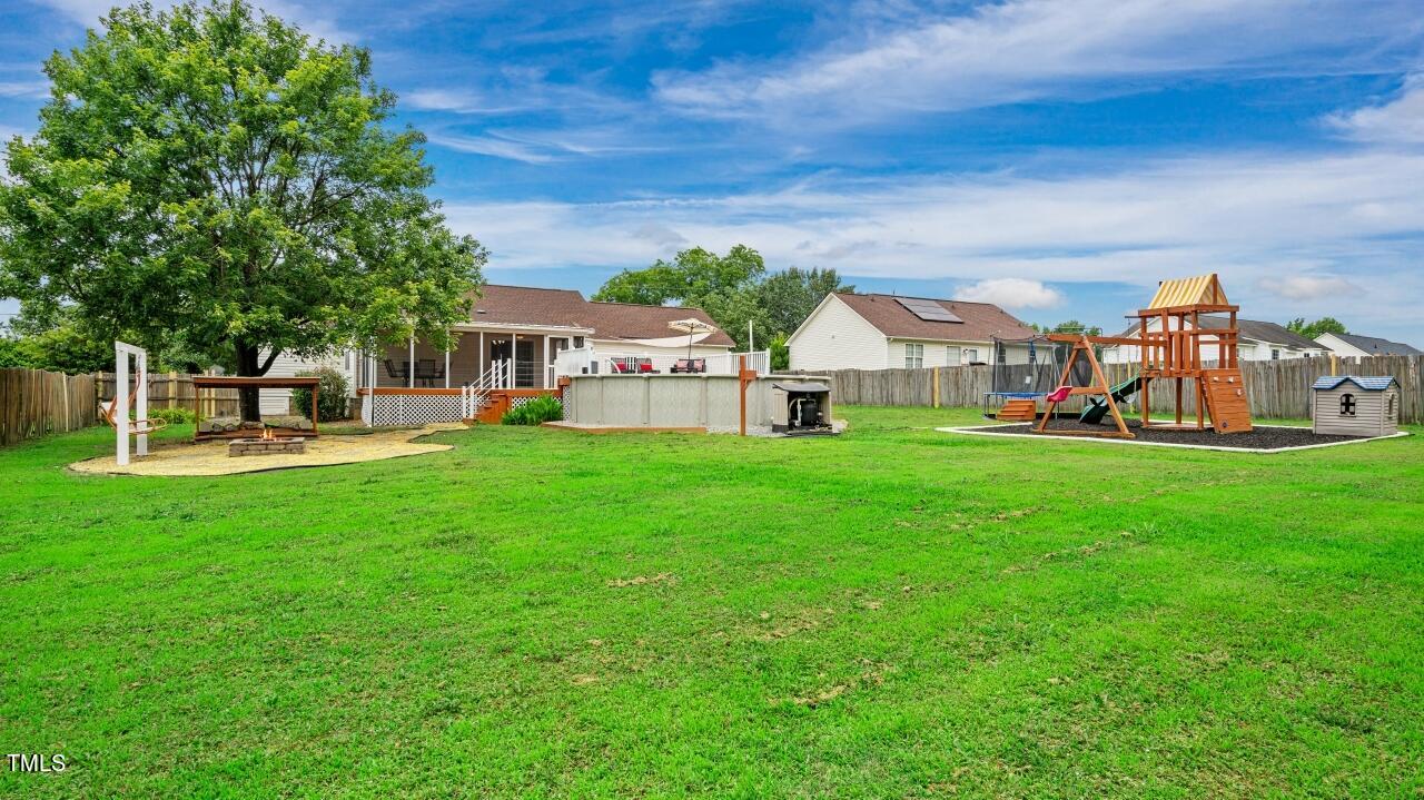 1065 Smith Road Smithfield, NC 27577 - Photo 34 of 36 a view of a house with a big yard and large trees