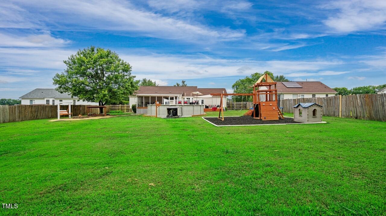 1065 Smith Road Smithfield, NC 27577 - Photo 35 of 36 a view of a house with a backyard