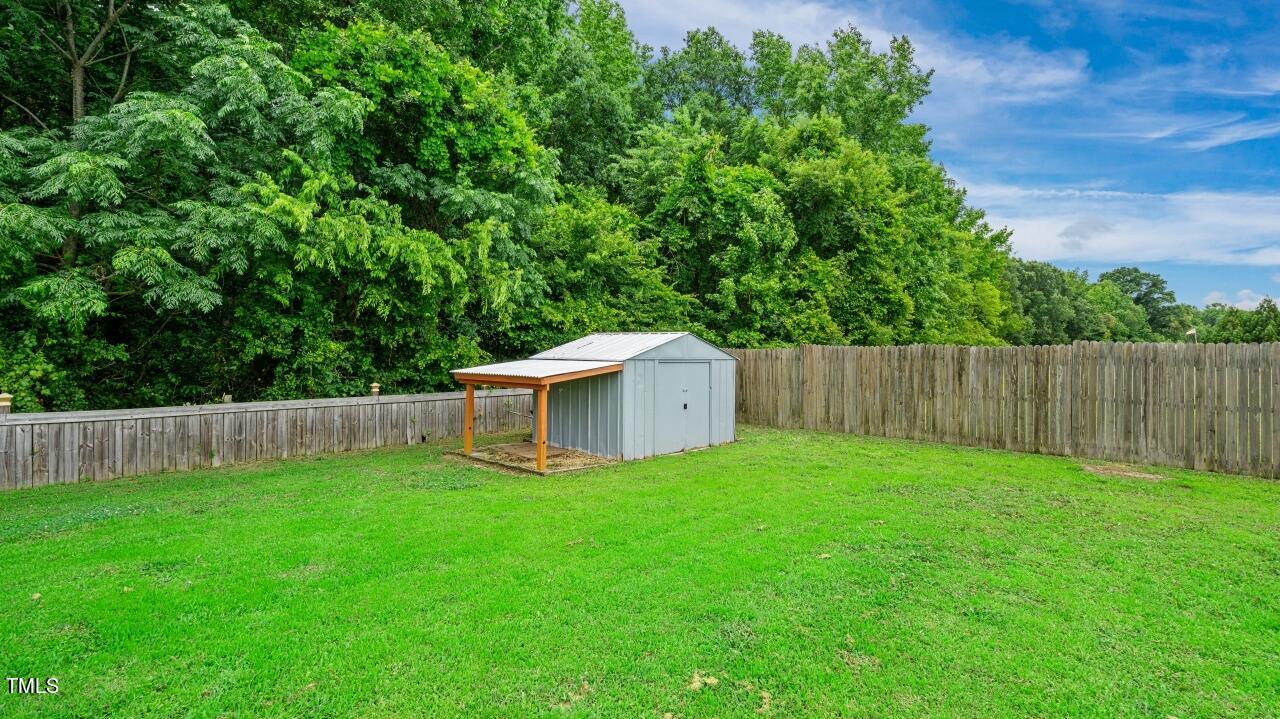 1065 Smith Road Smithfield, NC 27577 - Photo 36 of 36 a garden with wooden fence