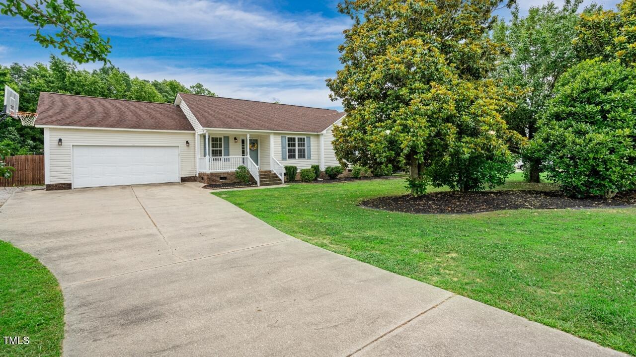 1065 Smith Road Smithfield, NC 27577 - Photo 5 of 36 a view of house with a yard