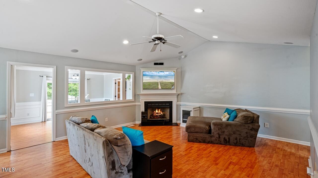 1065 Smith Road Smithfield, NC 27577 - Photo 7 of 36 a living room with fireplace furniture and a fireplace
