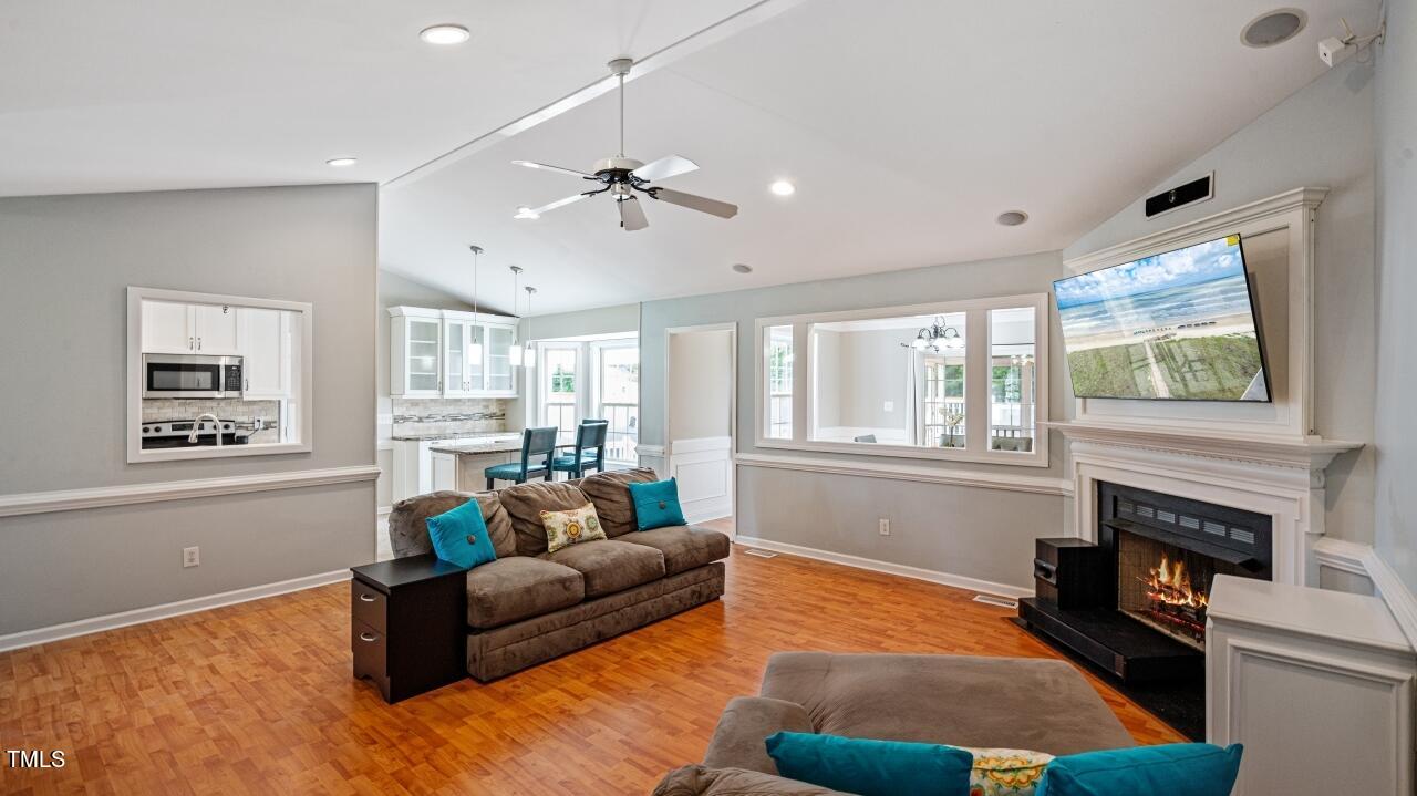 1065 Smith Road Smithfield, NC 27577 - Photo 8 of 36 a living room with furniture and a fireplace