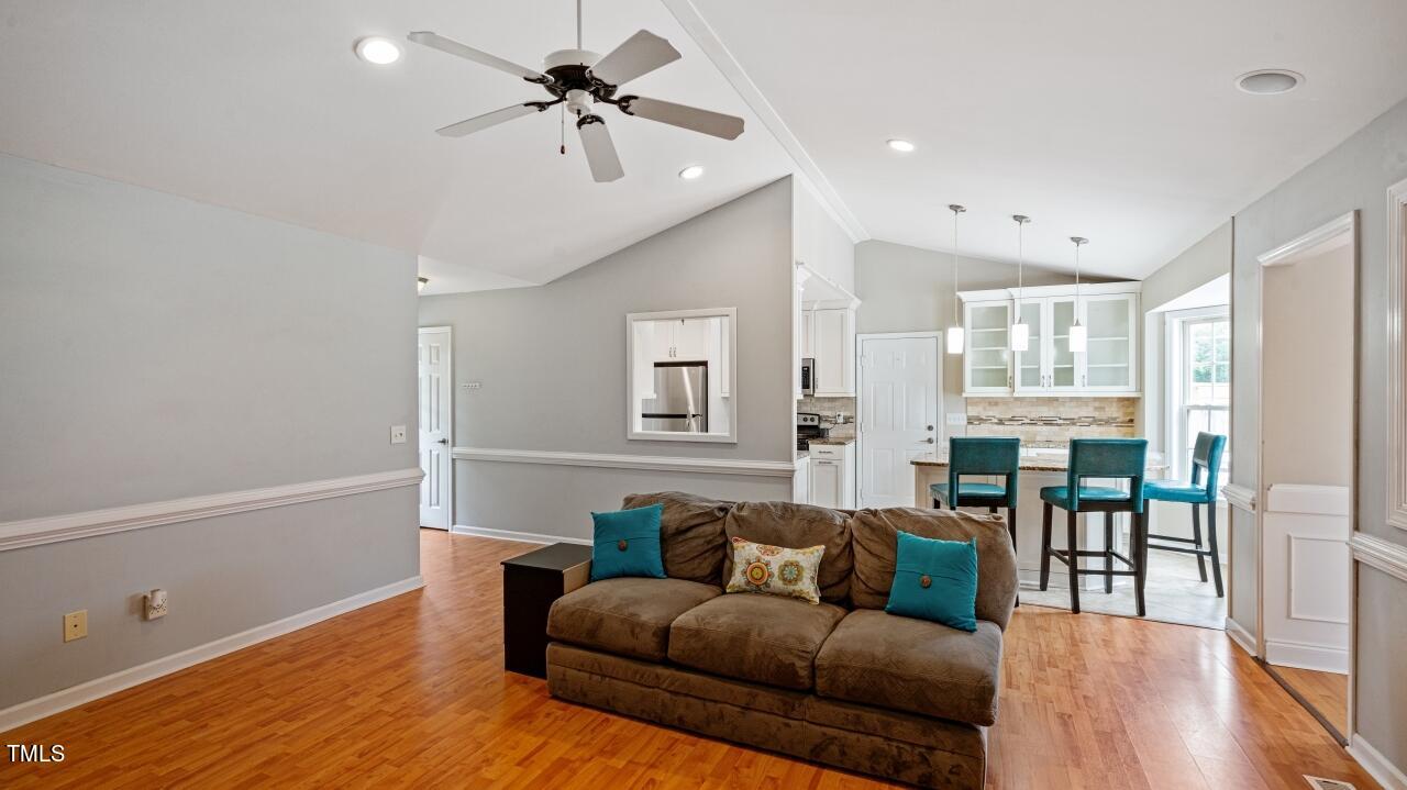 1065 Smith Road Smithfield, NC 27577 - Photo 9 of 36 a living room with furniture and wooden floor