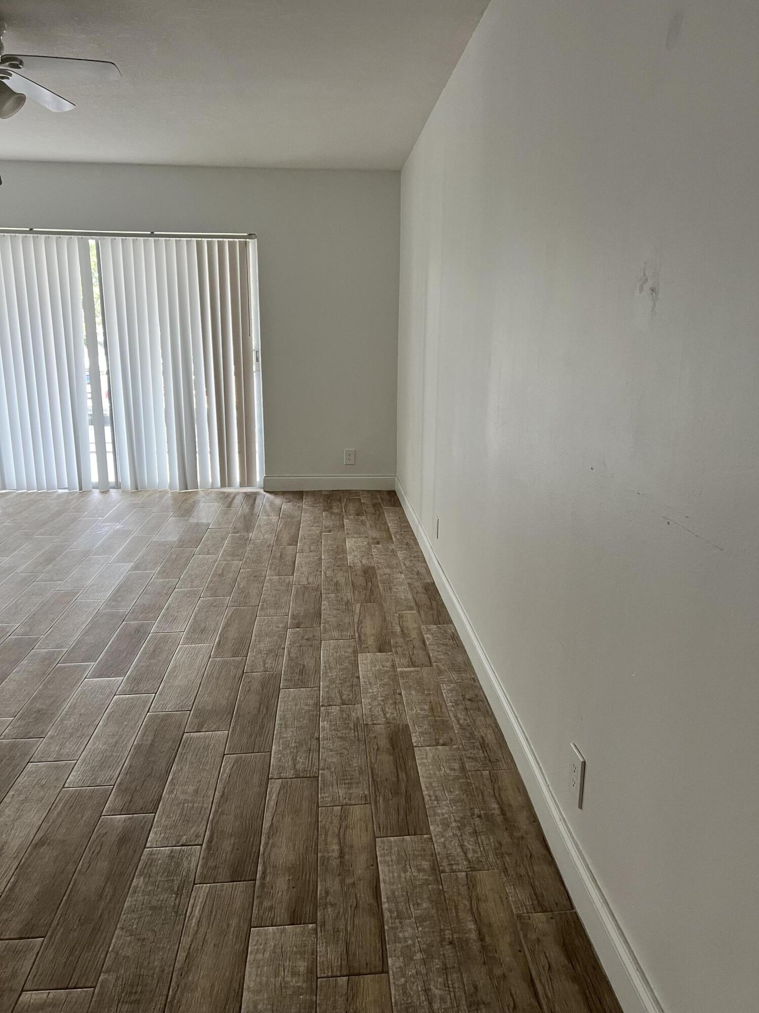 632 Northwest 13th Street, Unit 210 Boca Raton, FL 33486 - Photo 3 of 19 a view of wooden floor