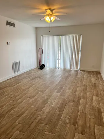 a view of an empty room with a window