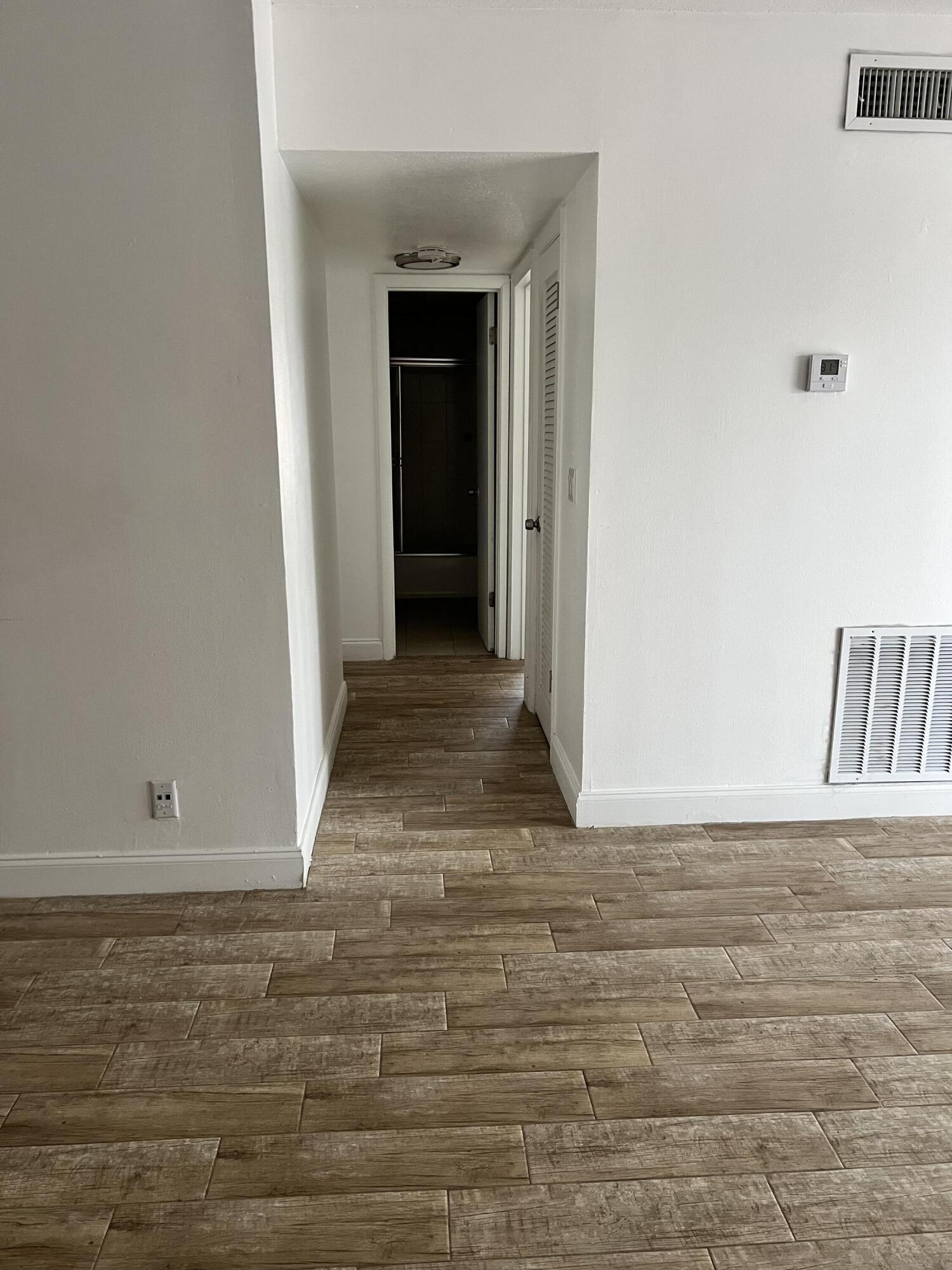 632 Northwest 13th Street, Unit 210 Boca Raton, FL 33486 - Photo 7 of 19 a view of wooden floor