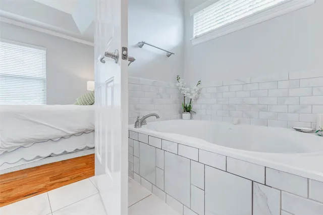 a bathroom with a bathtub and a sink