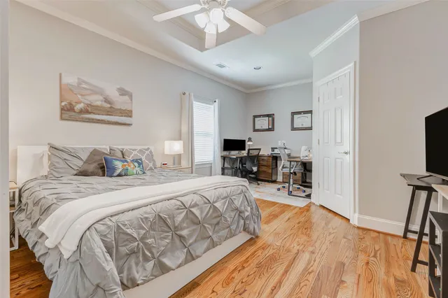 a bed room with a bed and a flat screen tv