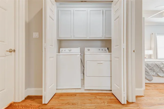 a view of storage and utility room with washer and dryer