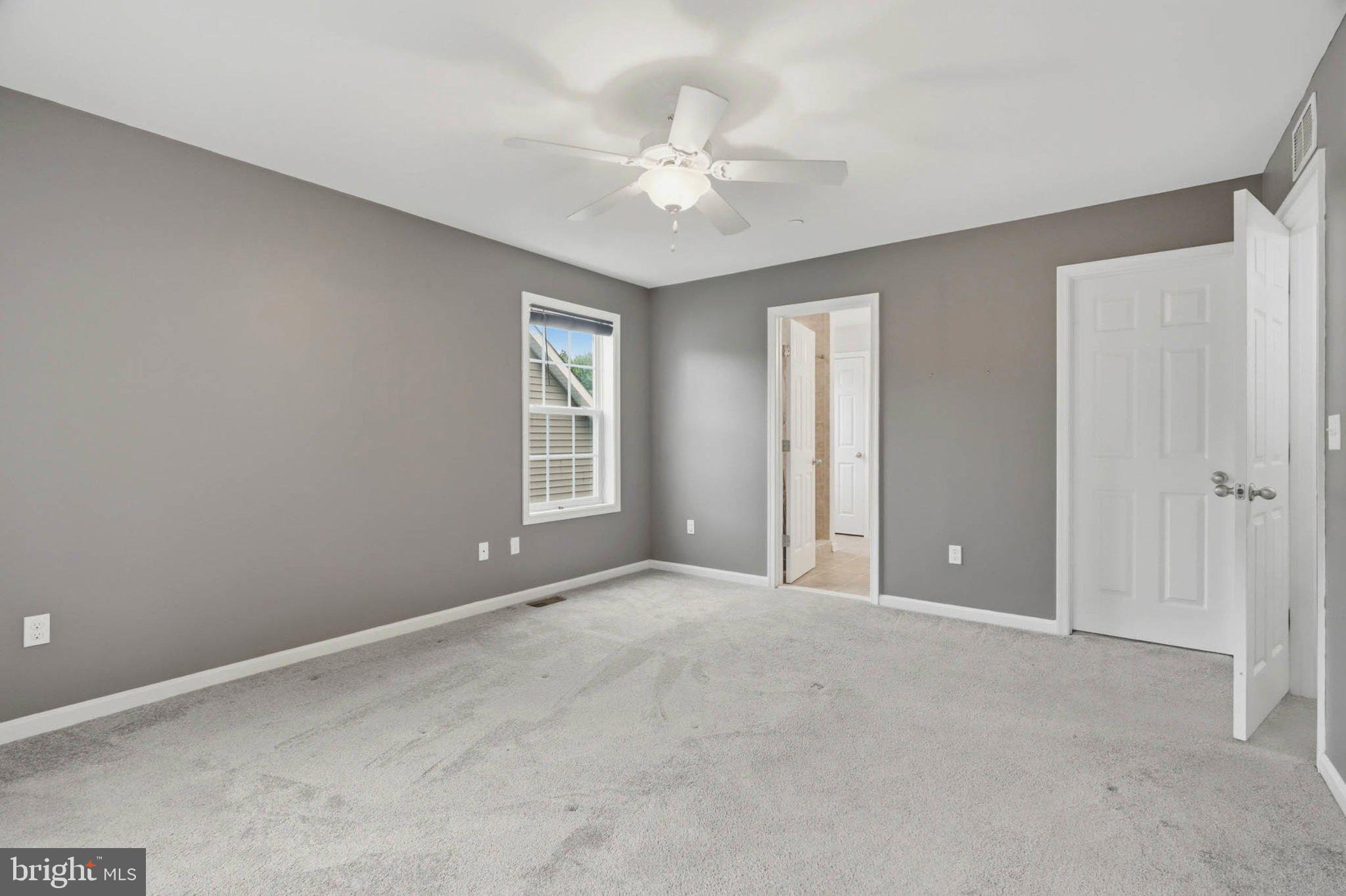 706 Trapper Way Deale, MD 20751 - Photo 36 of 61 Spacious room with soft gray tones.