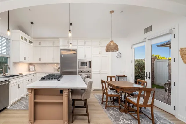 a kitchen with a table and chairs in it