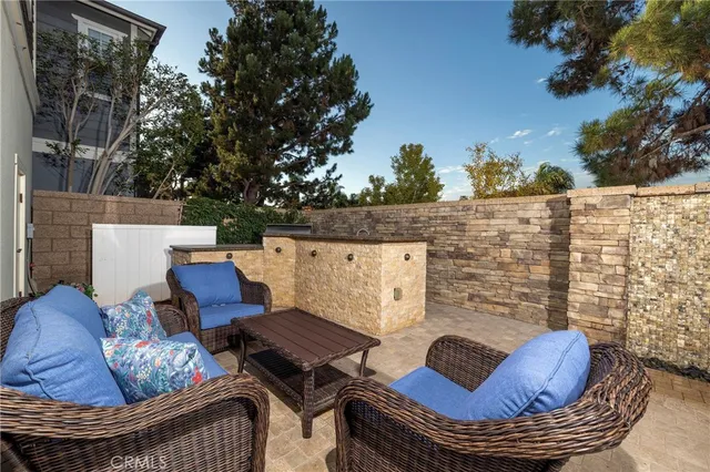 a outdoor living space with furniture and a fireplace