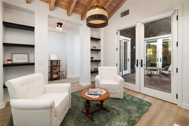 a living room with furniture and a rug