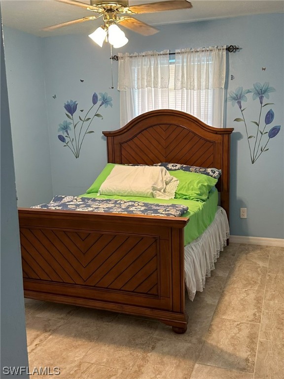 110 Florida Road Lehigh Acres, FL 33936 - Photo 6 of 10 a bedroom with a bed and a window