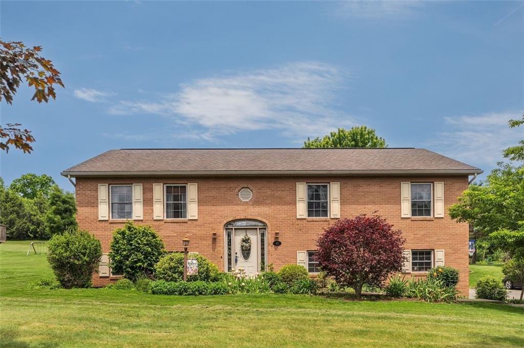 152 Cupps Road Renfrew, PA 16053 - Photo 1 of 43 a front view of a house with a garden