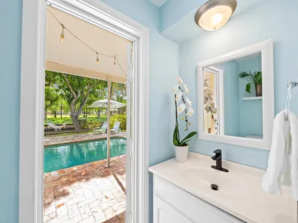 a bathroom with a sink and mirror