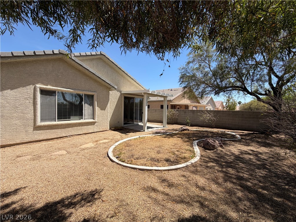 10975 Pumpkin Ridge Avenue Las Vegas, NV 89135 - Photo 1 of 13 A well-maintained desert landscape frames this property, offering a private setting.