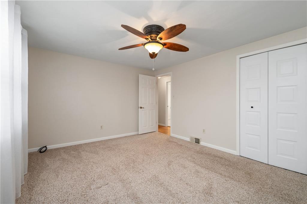 7 Dover Road Irwin, PA 15642 - Photo 13 of 31 a view of an empty room with a ceiling fan