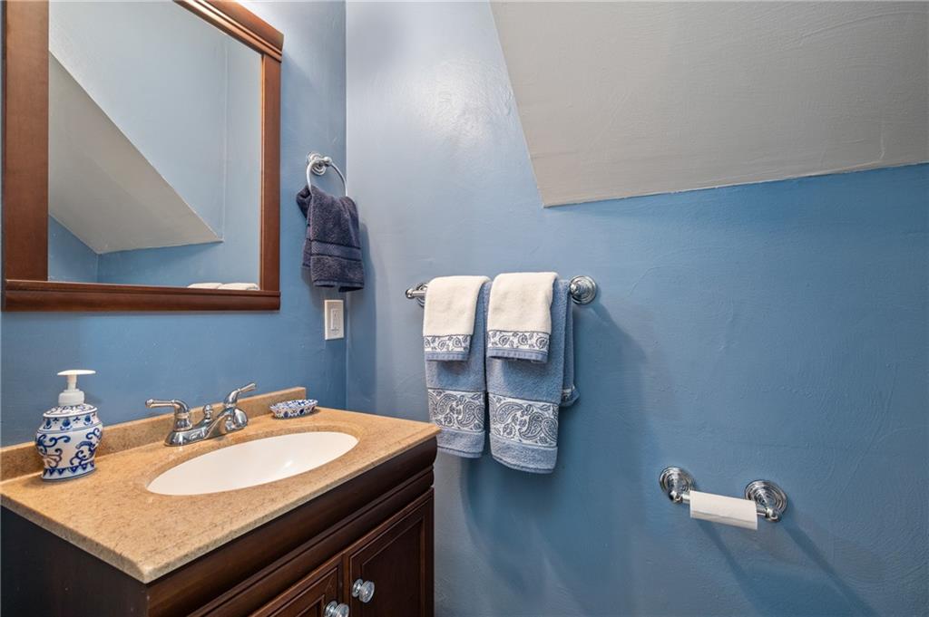 7 Dover Road Irwin, PA 15642 - Photo 21 of 31 a bathroom with a sink and a mirror