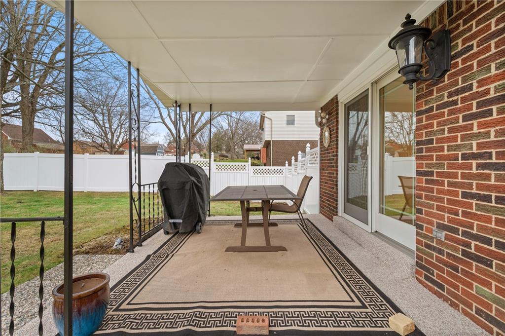 7 Dover Road Irwin, PA 15642 - Photo 22 of 31 a view of a patio with a table and chairs
