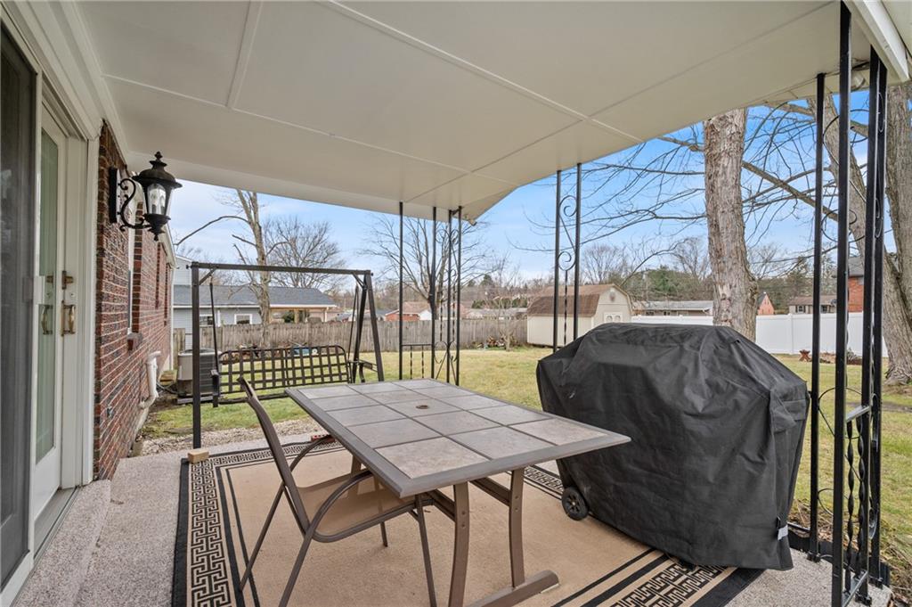 7 Dover Road Irwin, PA 15642 - Photo 23 of 31 a view of a patio with a table and chairs