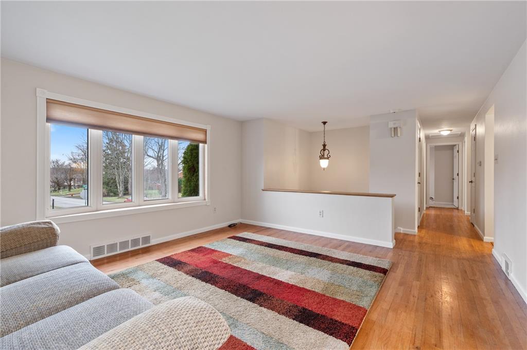 7 Dover Road Irwin, PA 15642 - Photo 3 of 31 a spacious bedroom with a bed and a large window