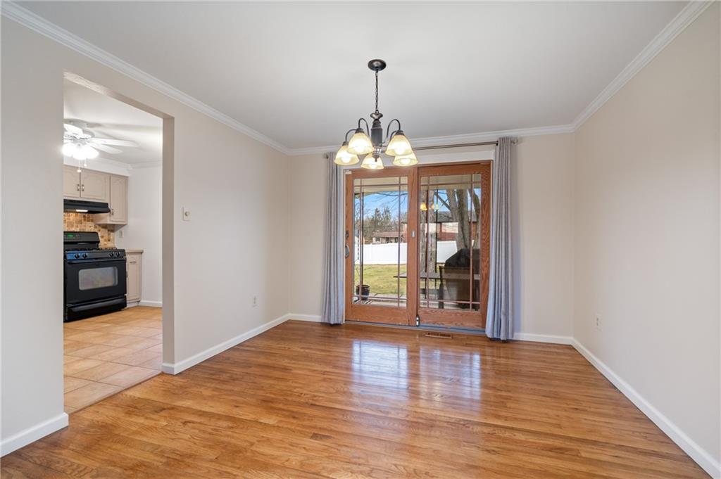 7 Dover Road Irwin, PA 15642 - Photo 6 of 31 wooden floor in an empty room with a window