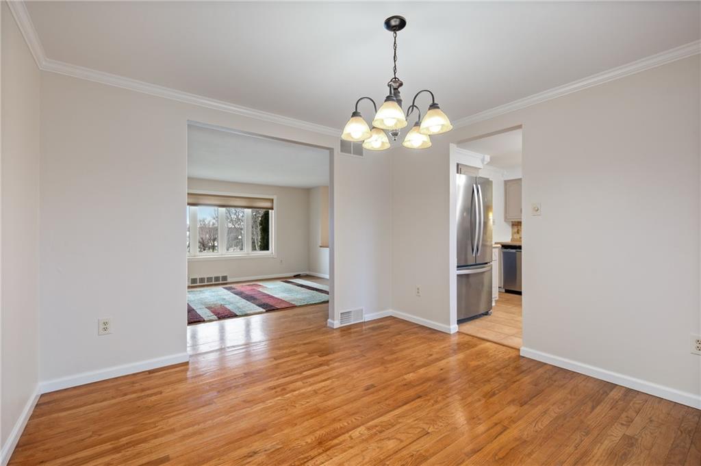 7 Dover Road Irwin, PA 15642 - Photo 7 of 31 a view of a room with wooden floor and chandelier