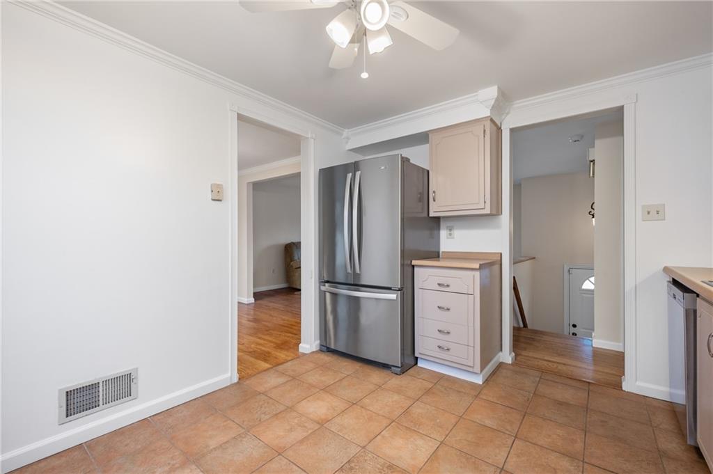 7 Dover Road Irwin, PA 15642 - Photo 8 of 31 a kitchen with white cabinets and stainless steel appliances