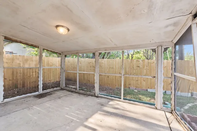 a view of a room with sliding glass door and mountain view