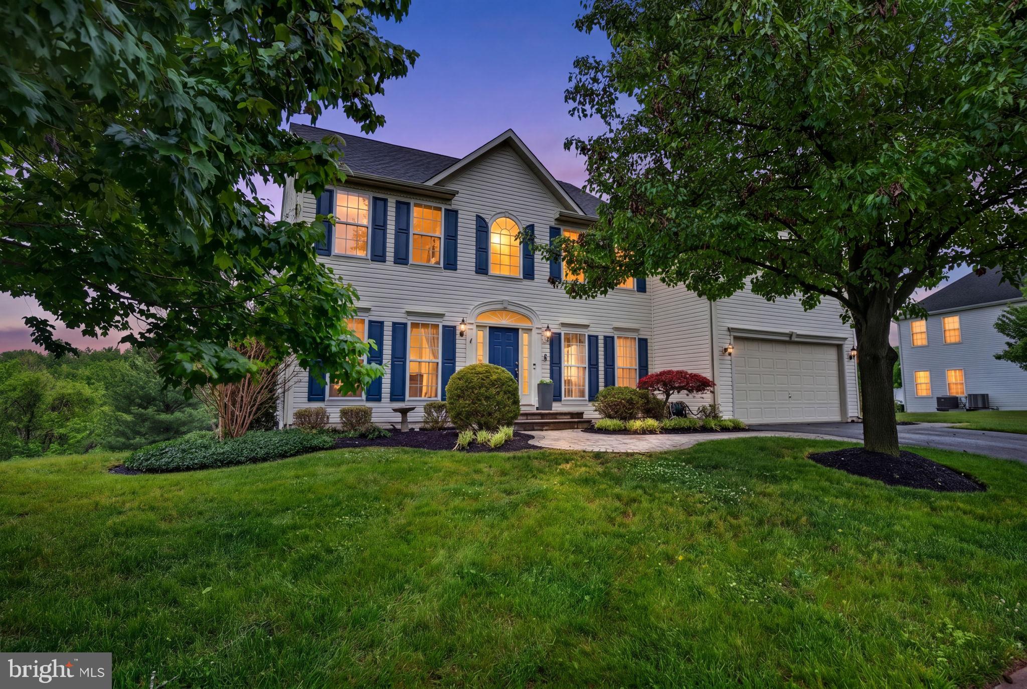 8 North Pointe Terrace Middletown, MD 21769 - Photo 1 of 74 a front view of a house with a garden and trees