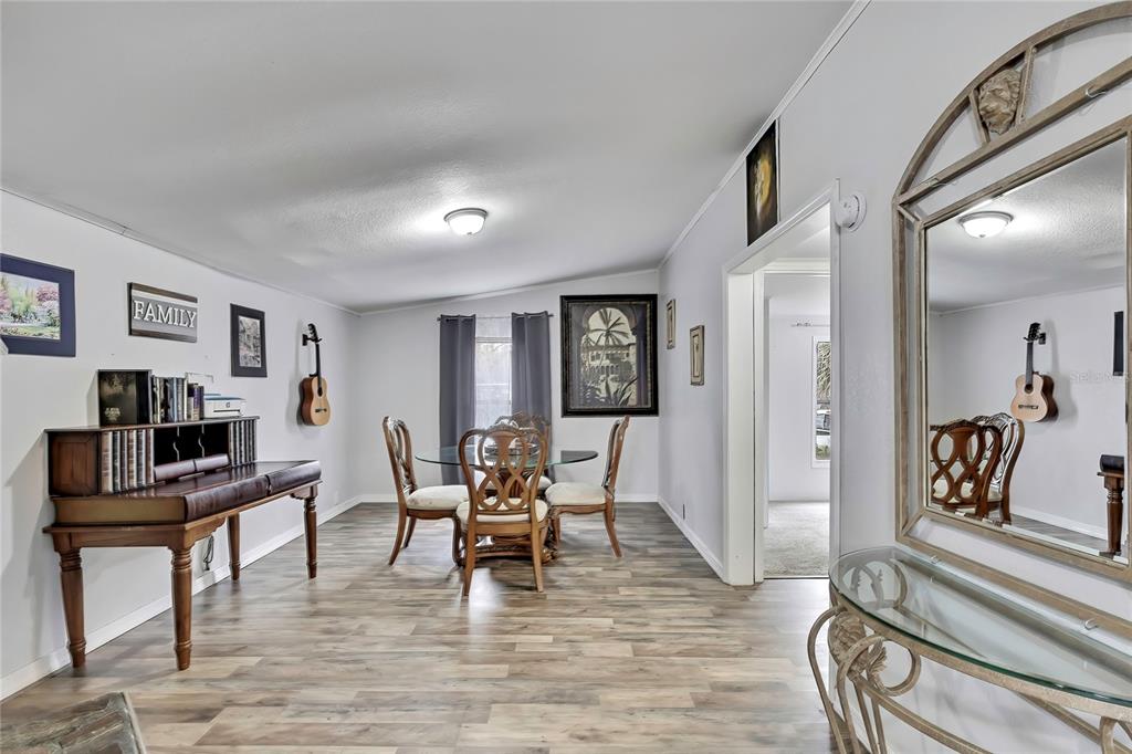 15739 Brenda Street Hudson, FL 34667 - Photo 13 of 50 a view of a livingroom with furniture and a workspace