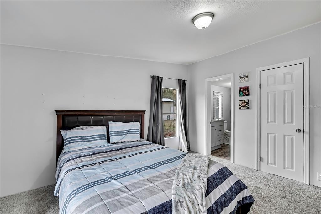 15739 Brenda Street Hudson, FL 34667 - Photo 17 of 50 a bedroom with a bed and a closet