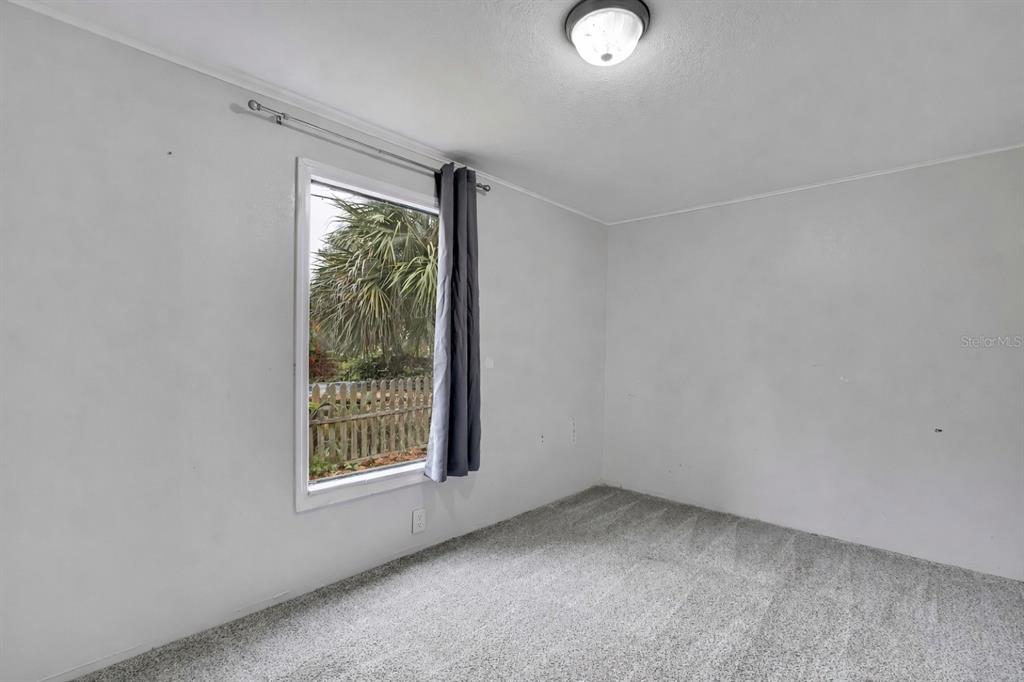 15739 Brenda Street Hudson, FL 34667 - Photo 25 of 50 an empty room with a window
