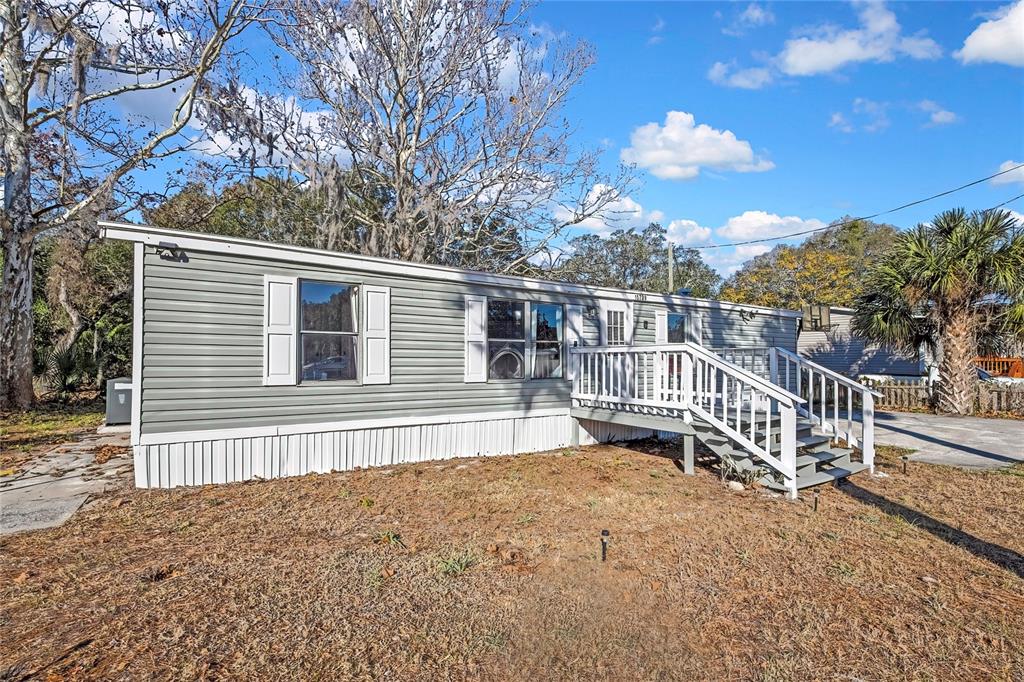 15739 Brenda Street Hudson, FL 34667 - Photo 38 of 50 a view of a house with a yard