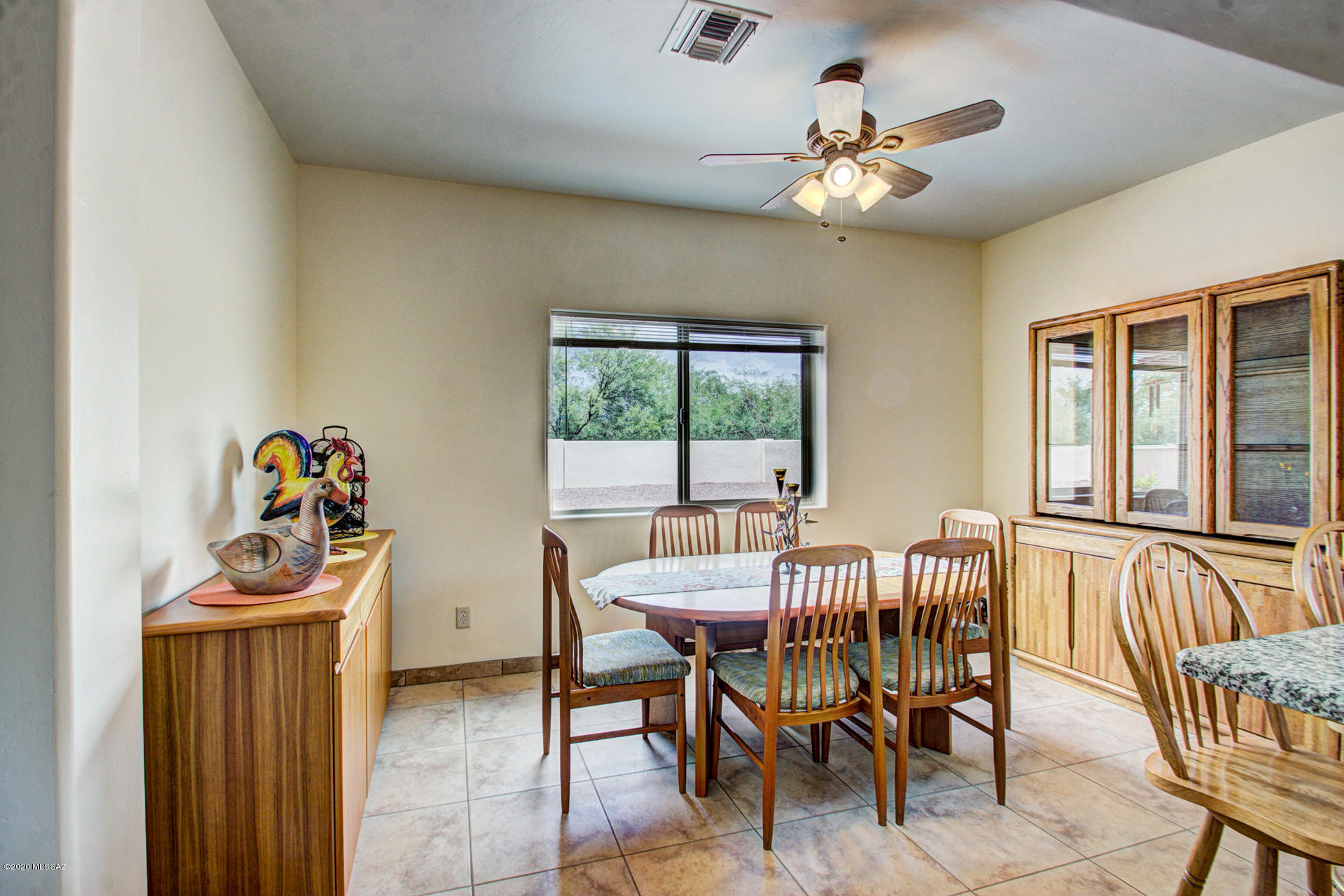 1689 Círculo Alameda Rio Rico, AZ 85648 - Photo 12 of 26 a view of a dining room with furniture and chandelier