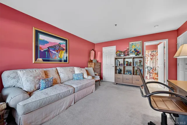 a living room with furniture and gym equipment