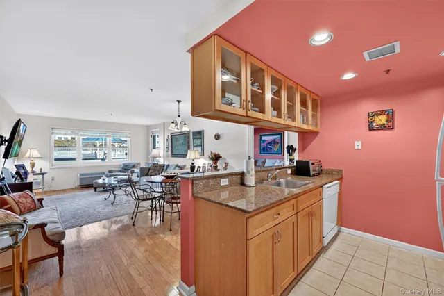 a kitchen with sink cabinets and dining table