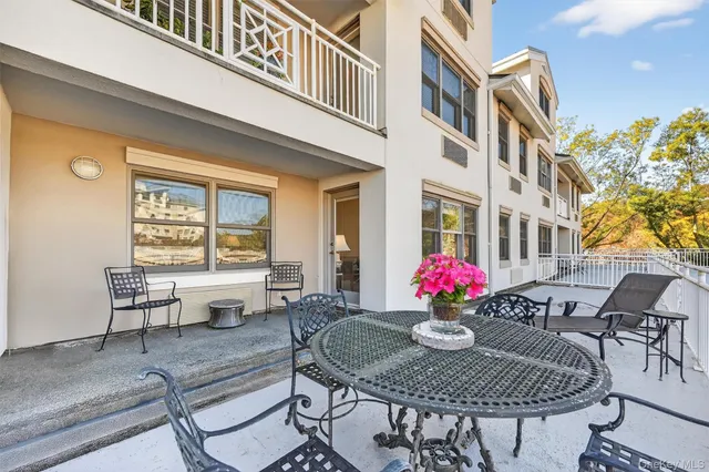 a view of a chairs and table in the patio