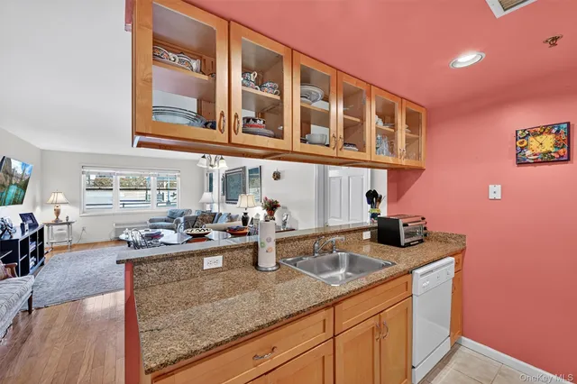a kitchen with stainless steel appliances granite countertop a sink and cabinets