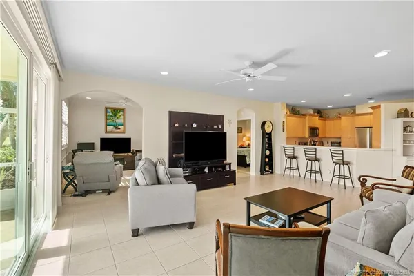 a living room with furniture and flat screen tv