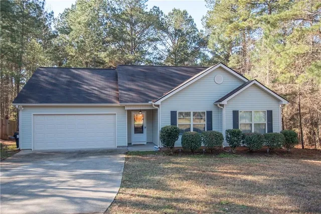 a house that has a tree in front of it