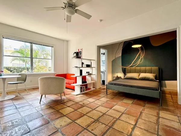 a living room with furniture and a window