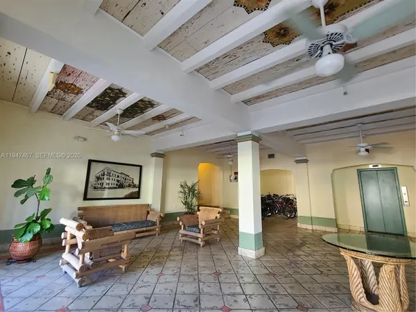a view of a living room and entryway